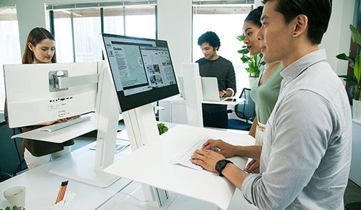 Employees at personal workstations that enable them to quickly configure their computer workstations for optimal health and productivity